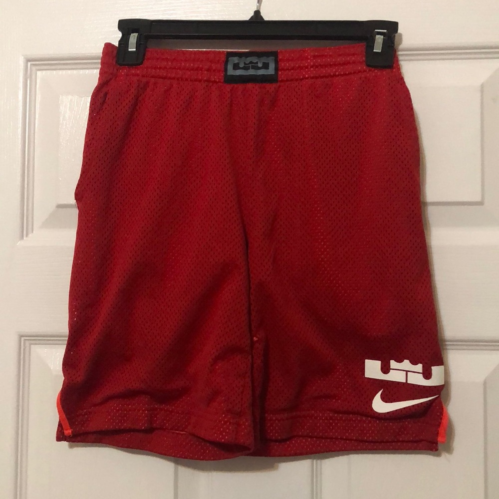 Nike boys red mesh Dri-Fit shorts.  Red with orange lining, comfortable and cool